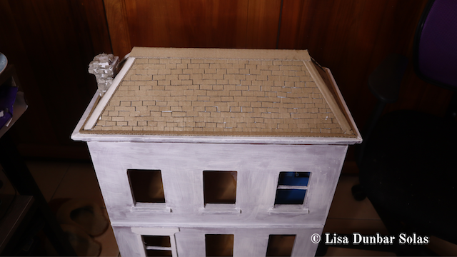 Revealing the exterior of the dollhouse