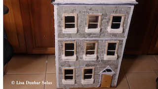 Fitting windows and doing up the door of the dollhouse